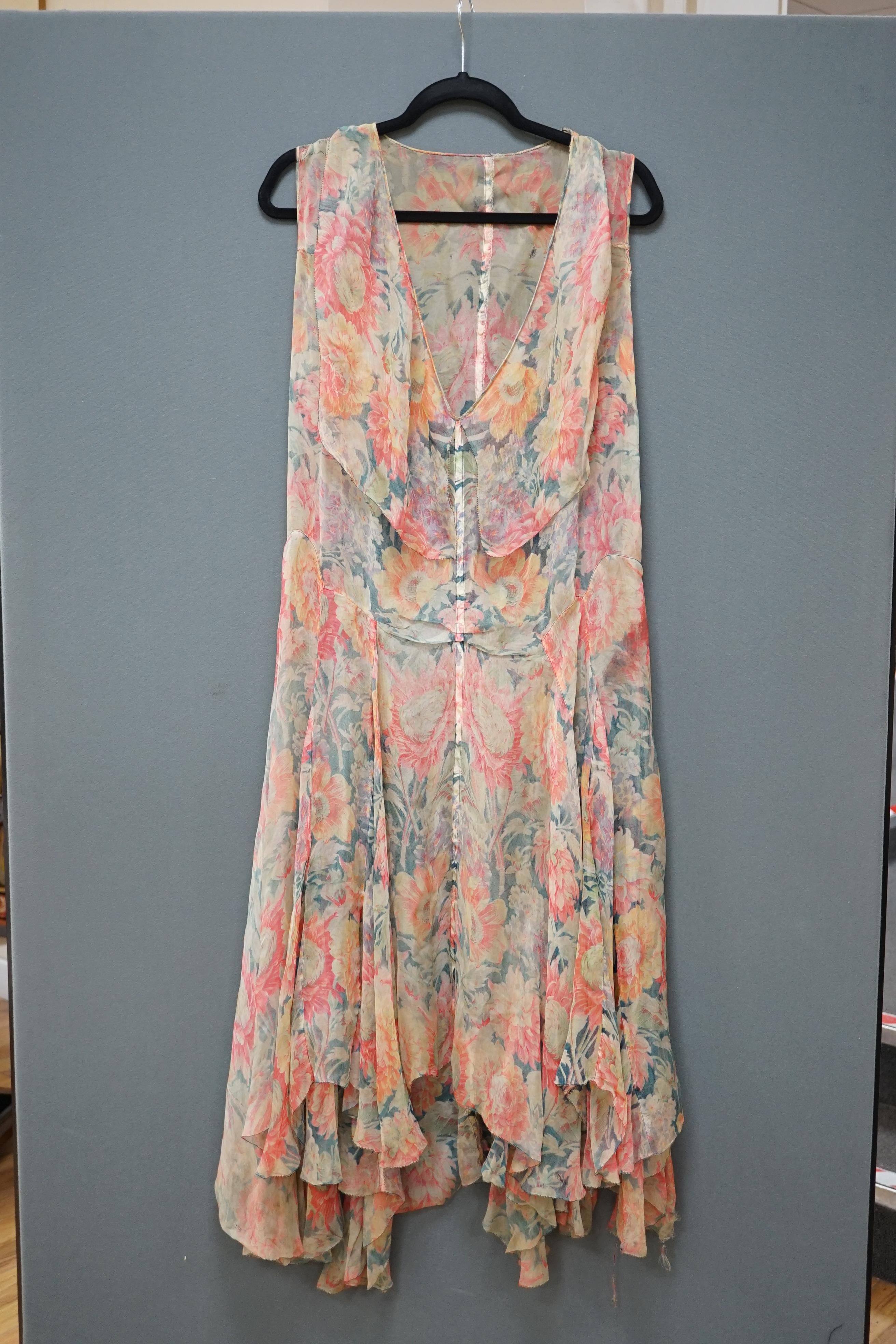 A 1930s printed sheer bias cut summer dress, hand made in a bright floral pattern silk organza style fabric, designed with a large collar and bias cut side panels. 42cm long from centre top back to hem. Condition - needs